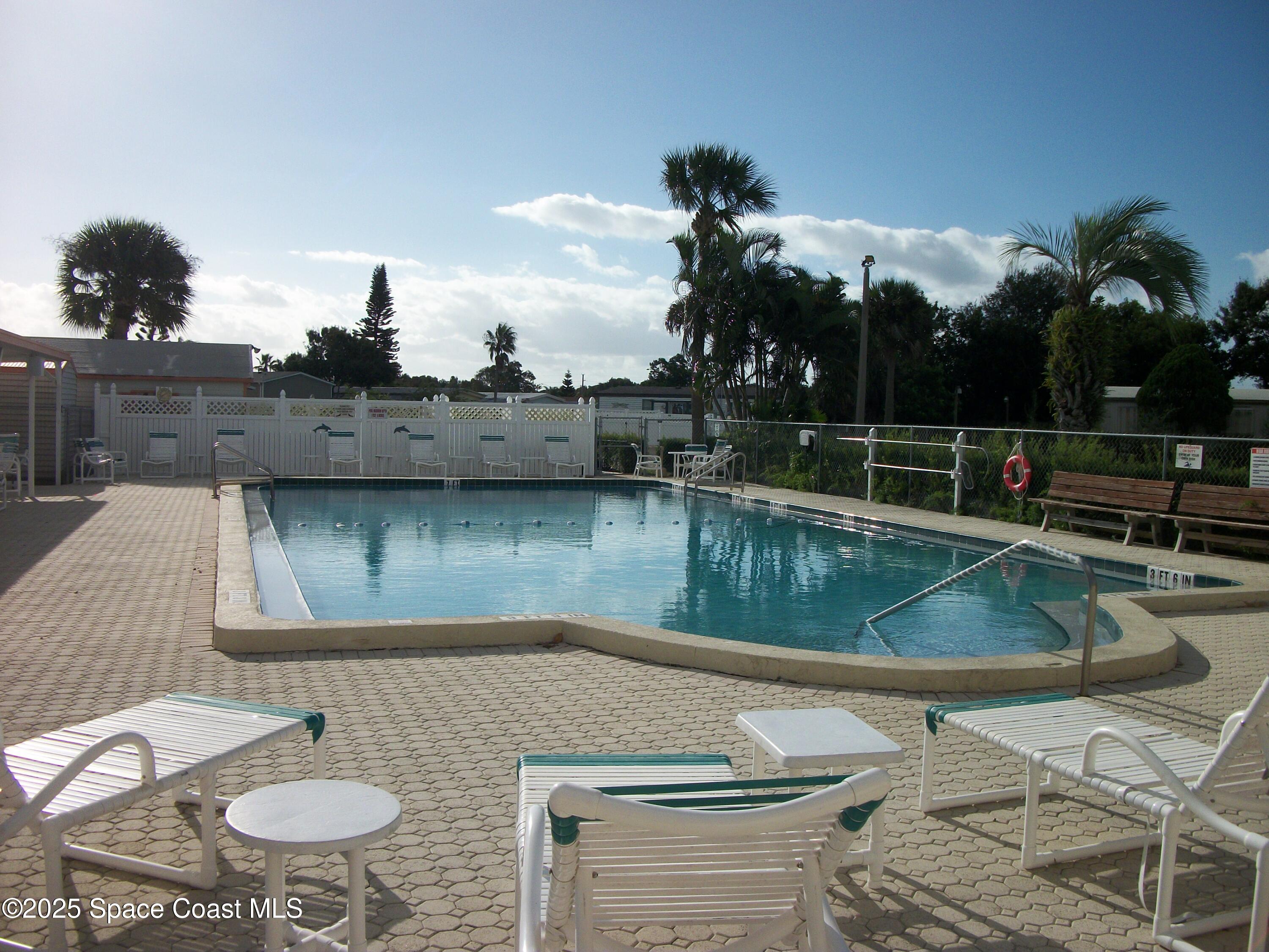 1972 Mango Street Northeast Palm Bay, FL 32905 - Photo 34 of 41 a view of a swimming pool with a patio