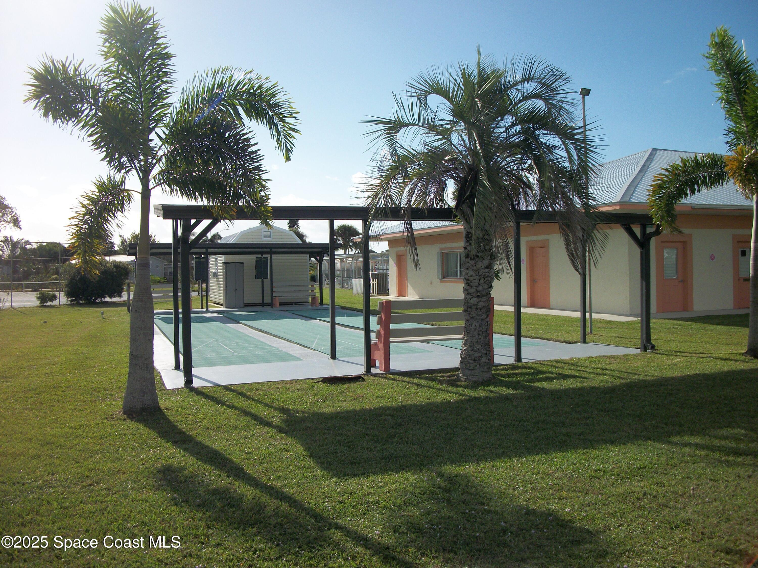 1972 Mango Street Northeast Palm Bay, FL 32905 - Photo 39 of 41 a view of a house with a yard