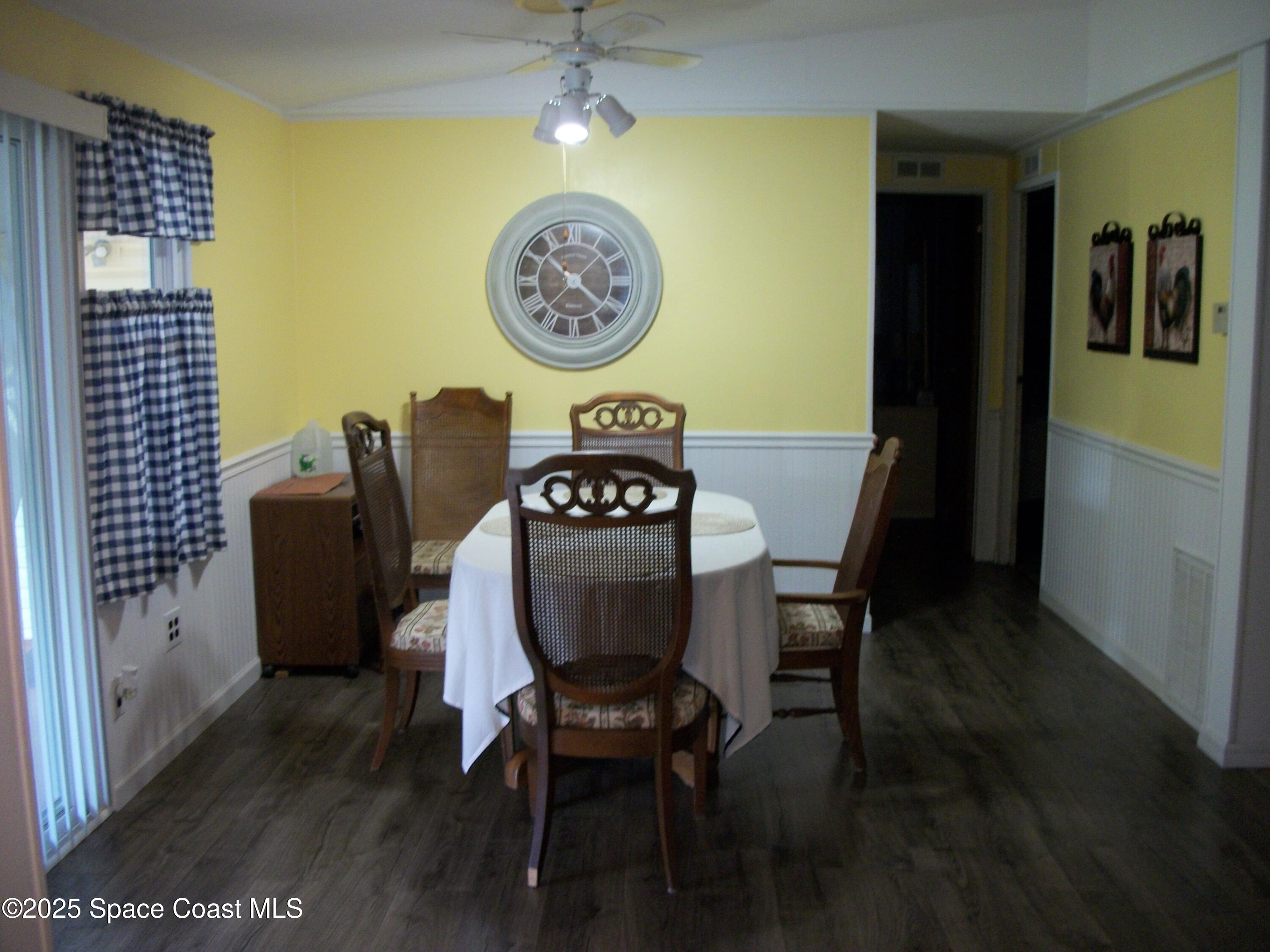 1972 Mango Street Northeast Palm Bay, FL 32905 - Photo 8 of 41 a view of a dining area with furniture and wooden floor