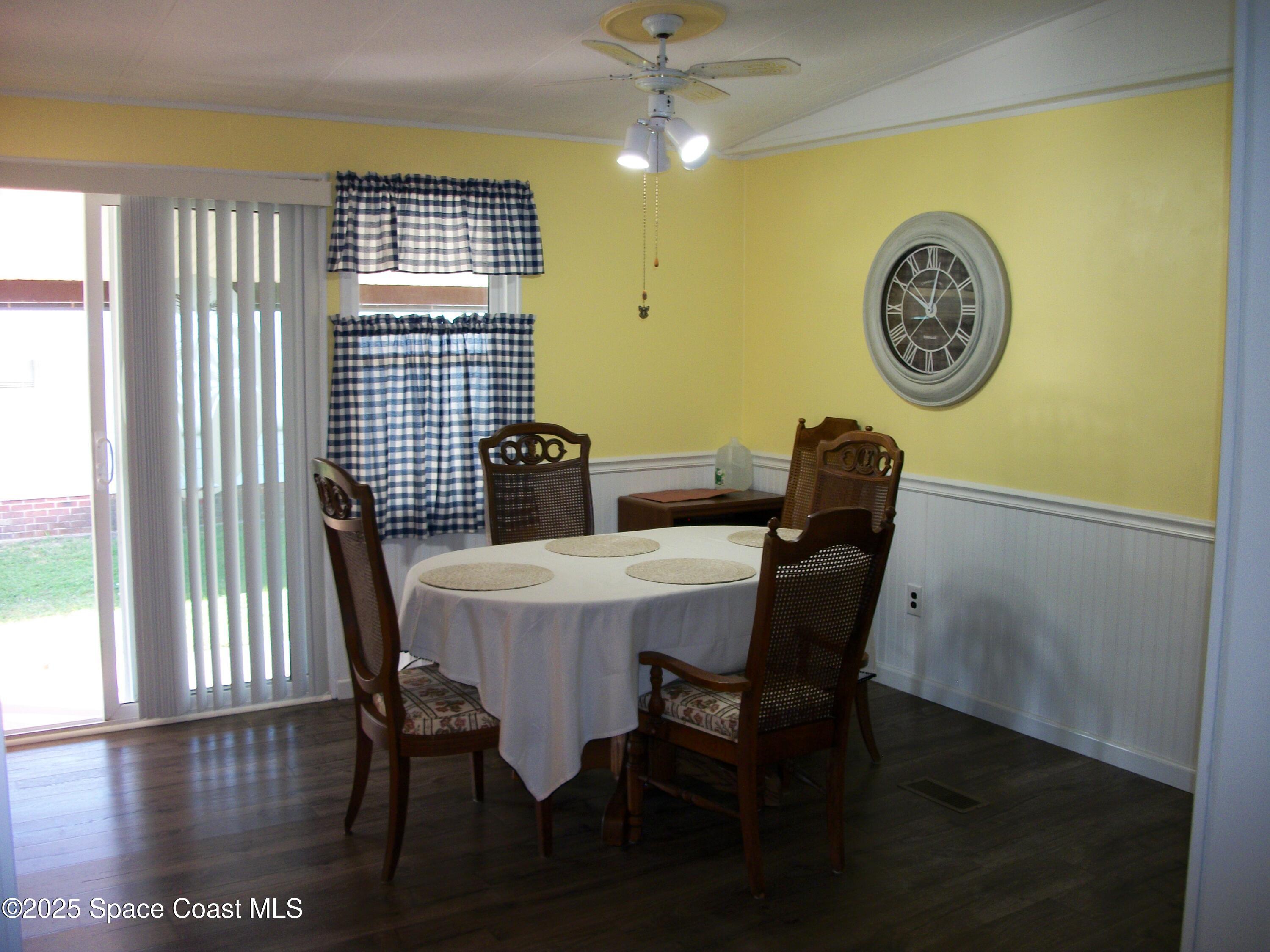 1972 Mango Street Northeast Palm Bay, FL 32905 - Photo 9 of 41 a view of a dining room with furniture and a large window