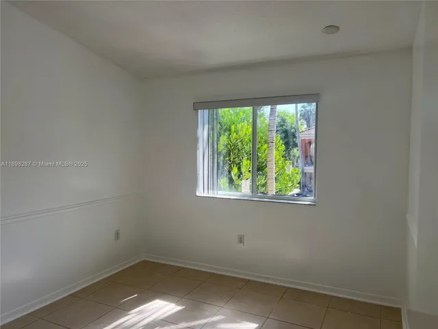 a bathroom with a shower curtain