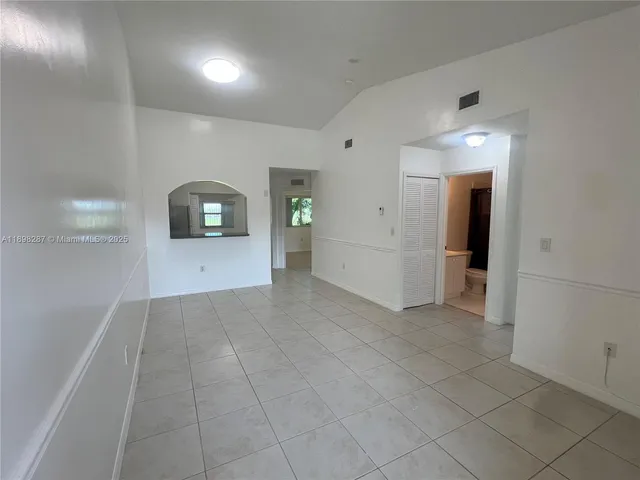 a kitchen with a white cabinets and white appliances