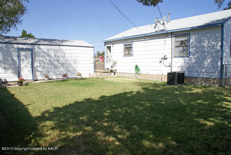1615 Southwest 48th Avenue Amarillo, TX 79110 - Photo 8 of 14 a view of a house with backyard and sitting area