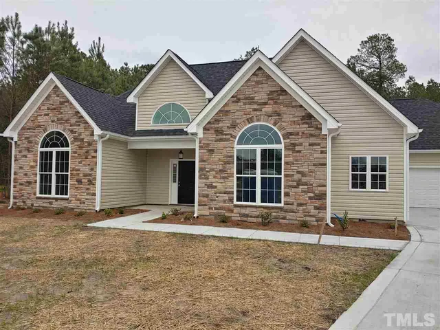 a front view of a house with yard