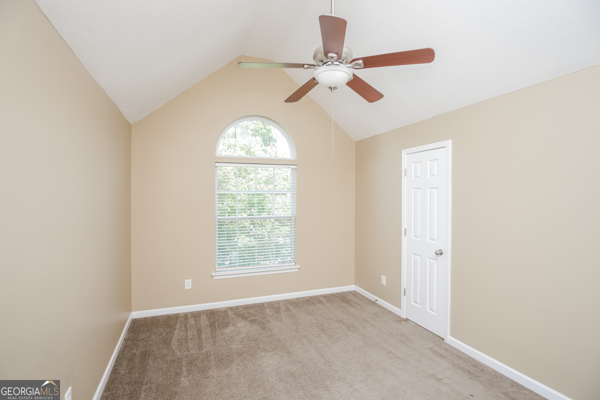 2002 Reflective Waters Road Villa Rica, GA 30180 - Photo 12 of 17 an empty room with windows and fan