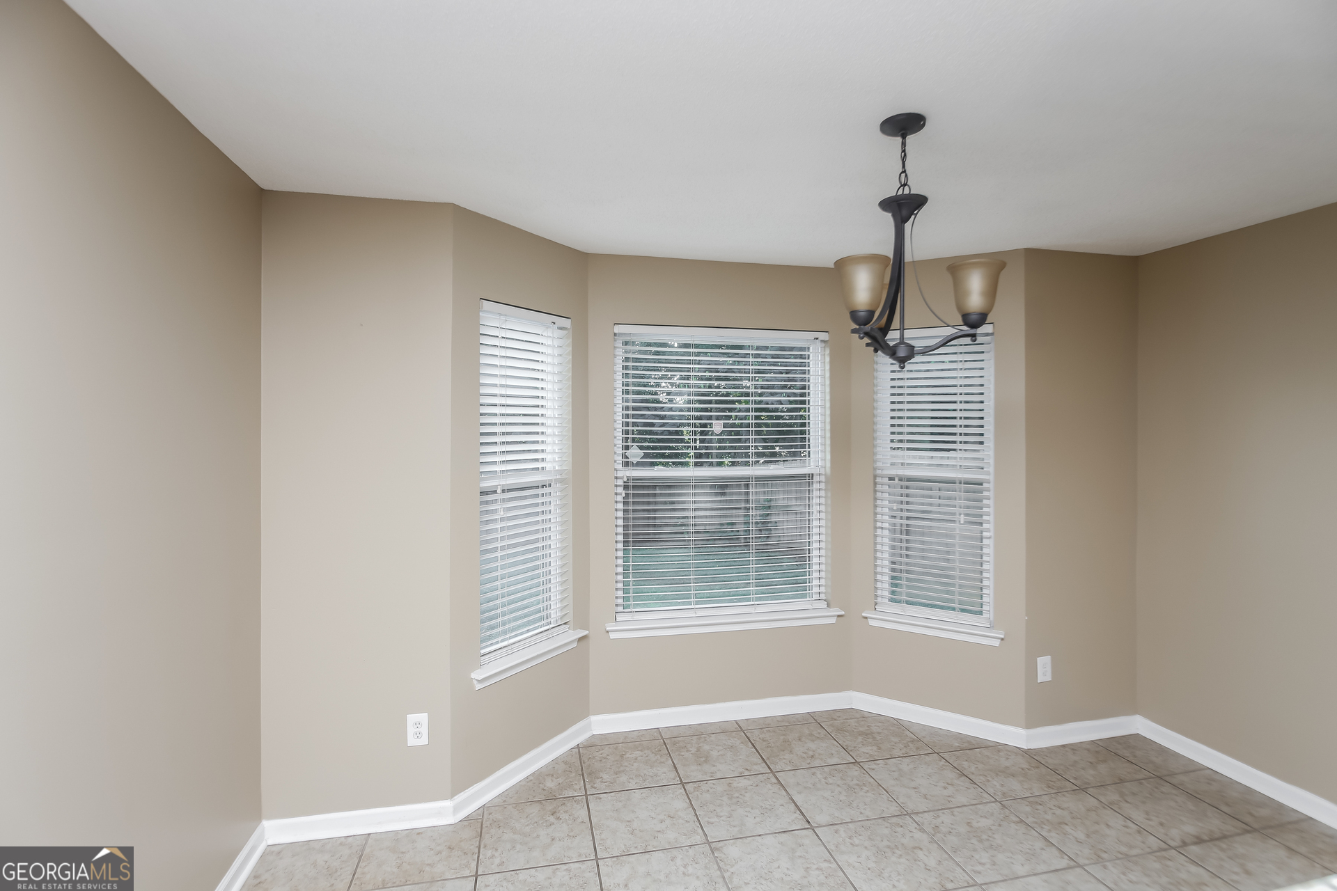 2002 Reflective Waters Road Villa Rica, GA 30180 - Photo 4 of 17 a view of an empty room with a window