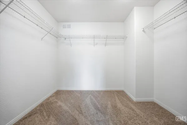 a view of an empty walk in closet