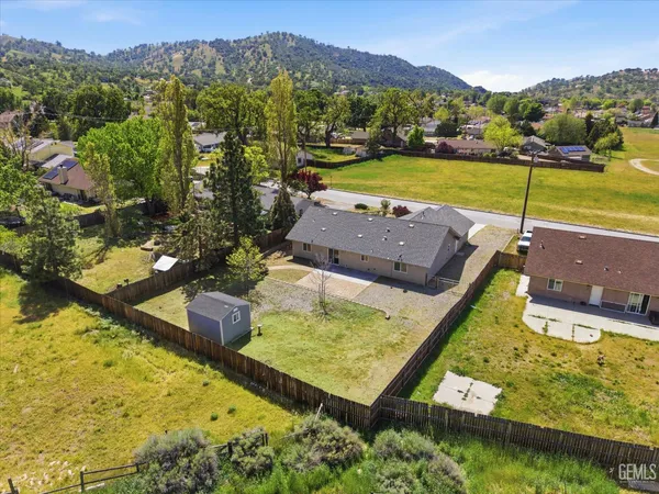 an aerial view of a house with a garden