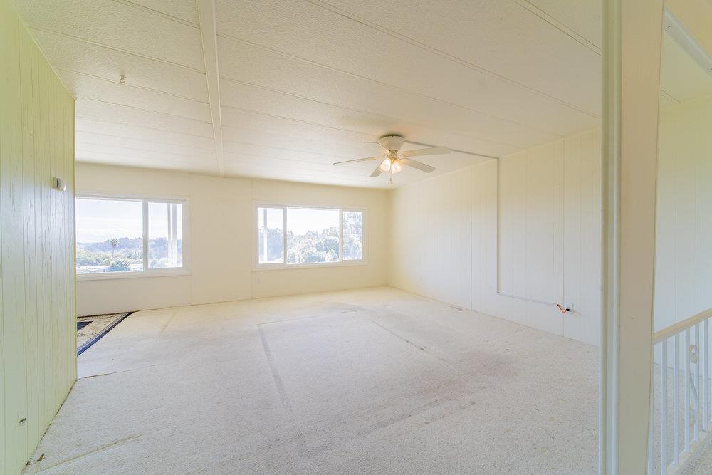270 Hames Road, Unit 76 Corralitos, CA 95076 - Photo 12 of 23 an empty room with windows