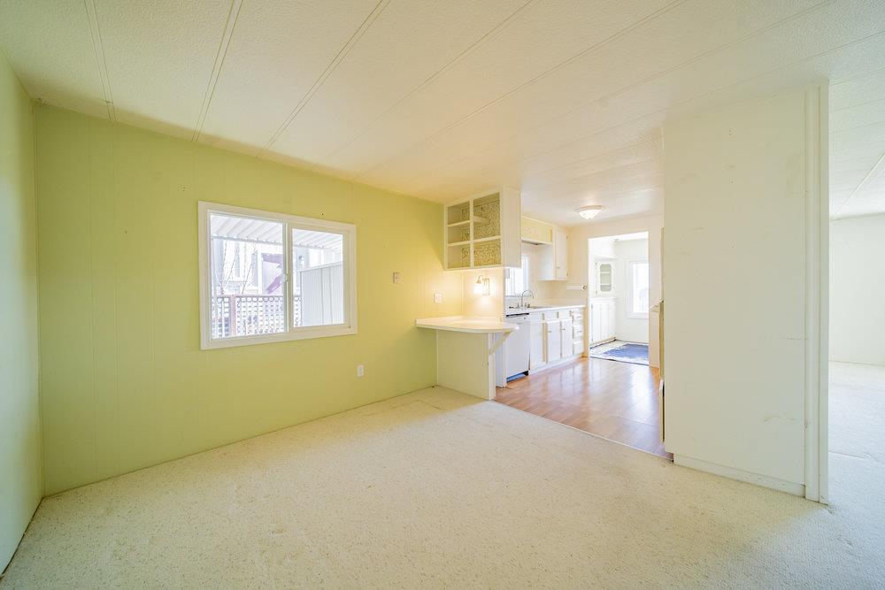 270 Hames Road, Unit 76 Corralitos, CA 95076 - Photo 14 of 23 a view of a room with wooden floor and a window