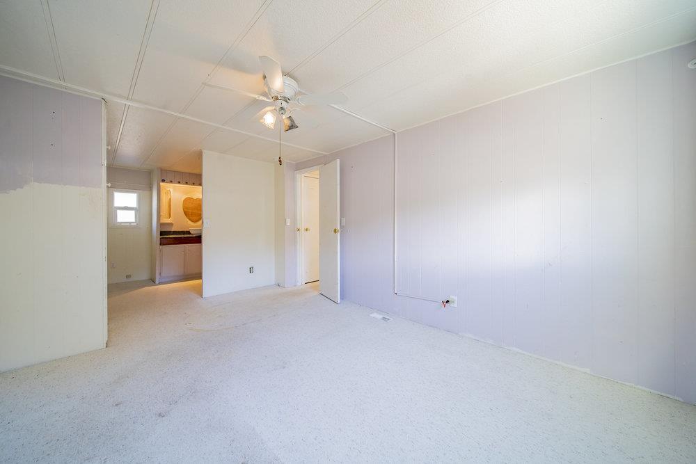 270 Hames Road, Unit 76 Corralitos, CA 95076 - Photo 16 of 23 wooden floor in an empty room with a window