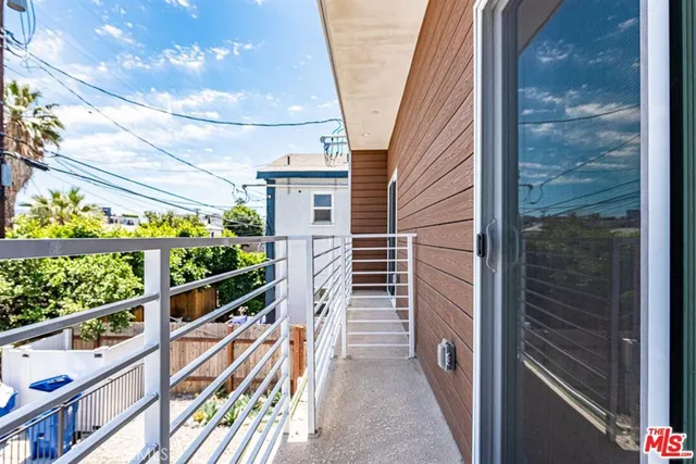 a view of balcony with wooden floor and outdoor space