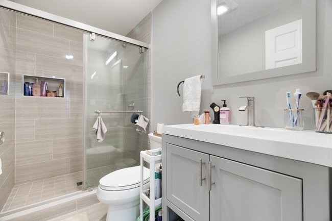 25 Pleasant Street Boston, MA 02125 - Photo 15 of 32 a bathroom with a sink a toilet and shower