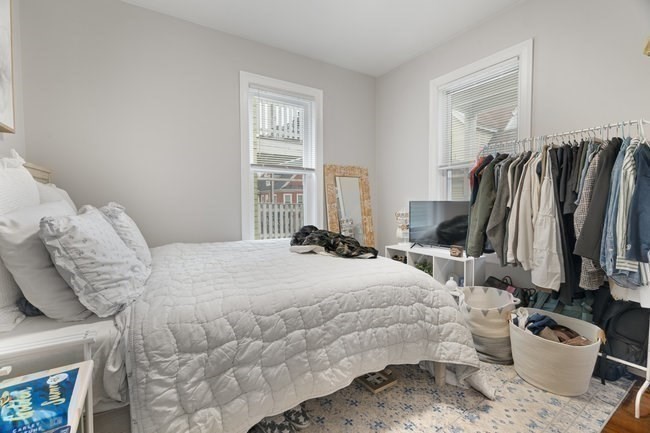 25 Pleasant Street Boston, MA 02125 - Photo 19 of 32 a bedroom with a bed and a window