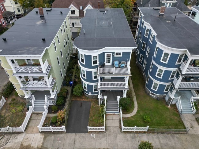 25 Pleasant Street Boston, MA 02125 - Photo 31 of 32 an aerial view of residential houses with outdoor space