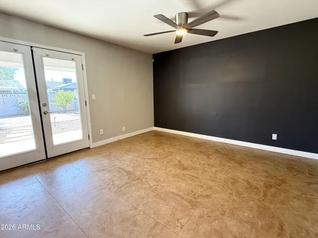 an empty room with a empty space and a large window