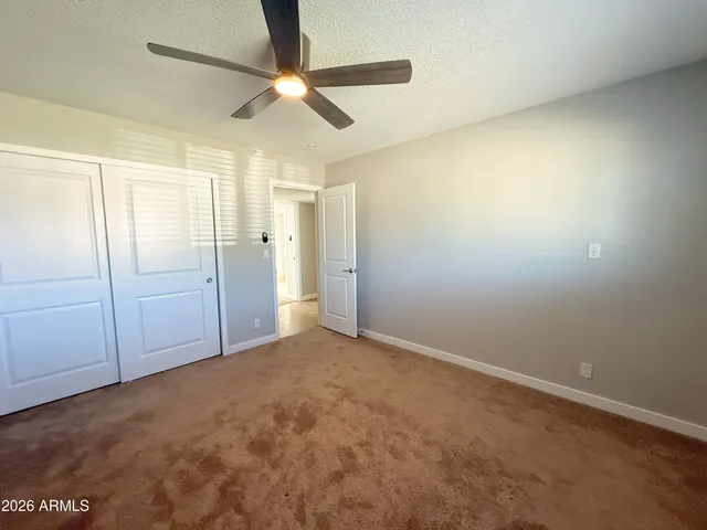 a bathroom with a sink a toilet a mirror and shower