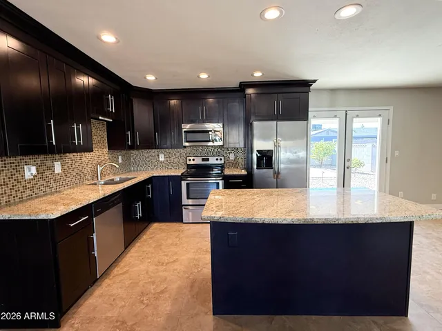 a large kitchen with a large counter top