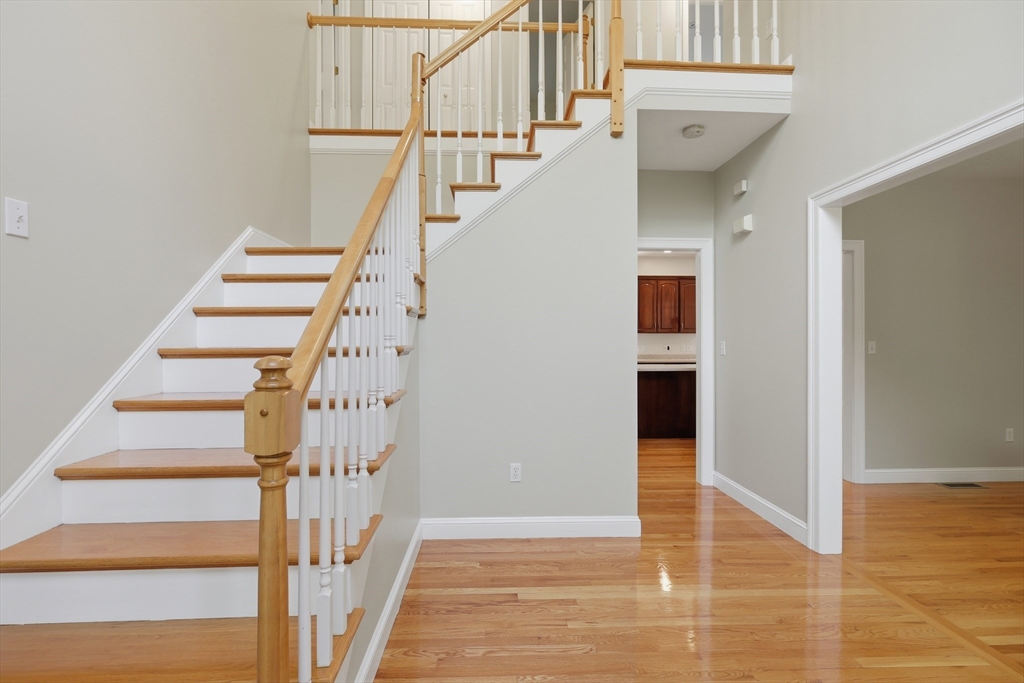 61 Indian Head Road Framingham, MA 01701 - Photo 16 of 42 a view of entryway and hall with wooden floor