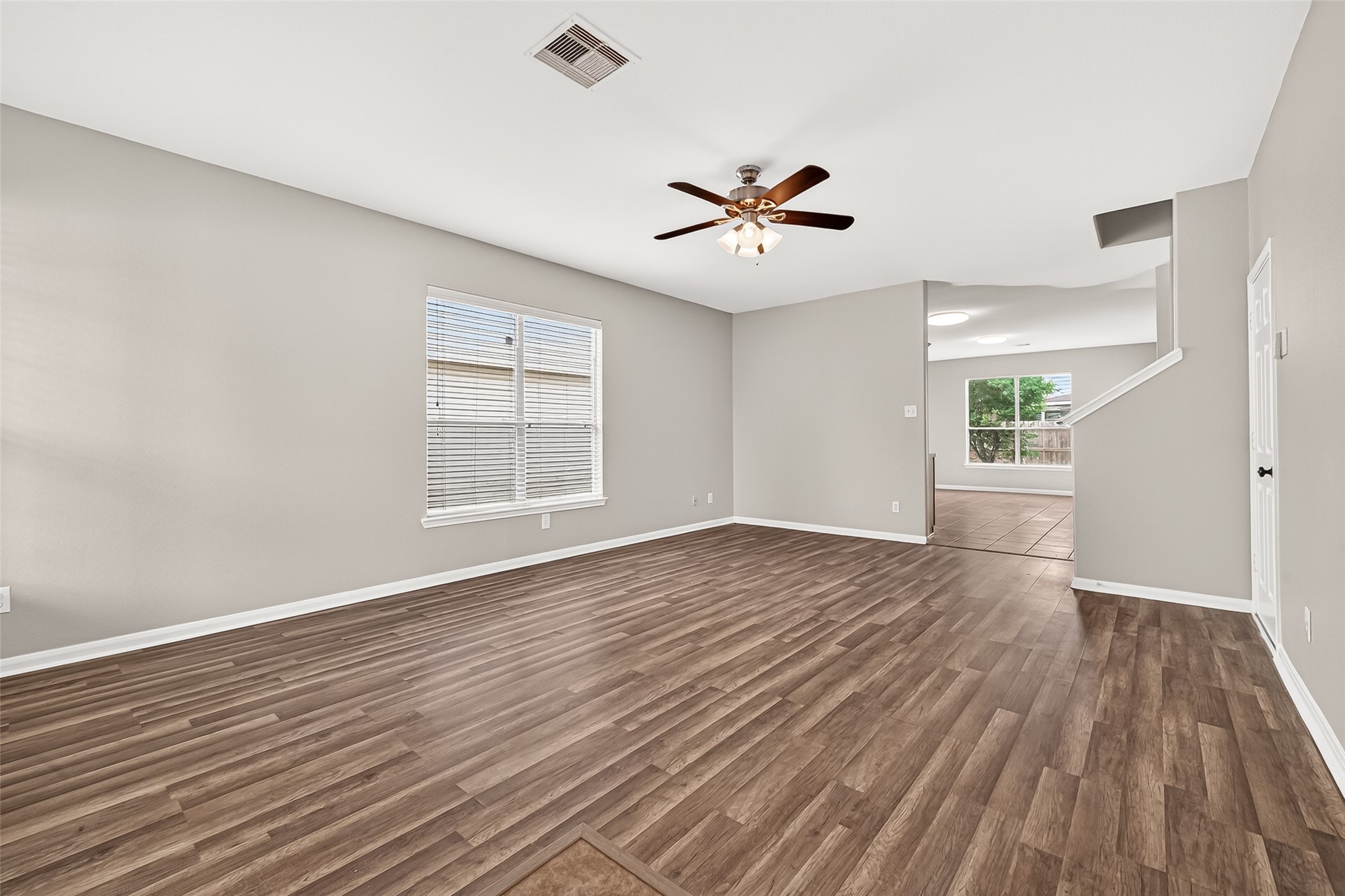 21327 Bella Flora Court Spring, TX 77379 - Photo 6 of 50 a view of empty room with wooden floor and fan