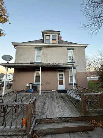 a view of a kitchen with a sink and cabinets