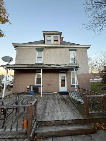 a view of a kitchen with a sink and cabinets
