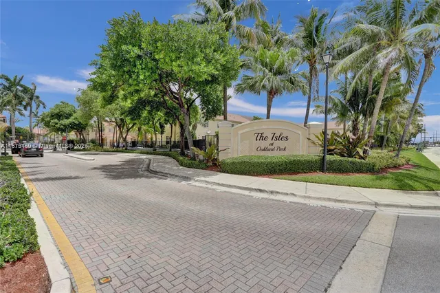an aerial view of a house with a yard and garden