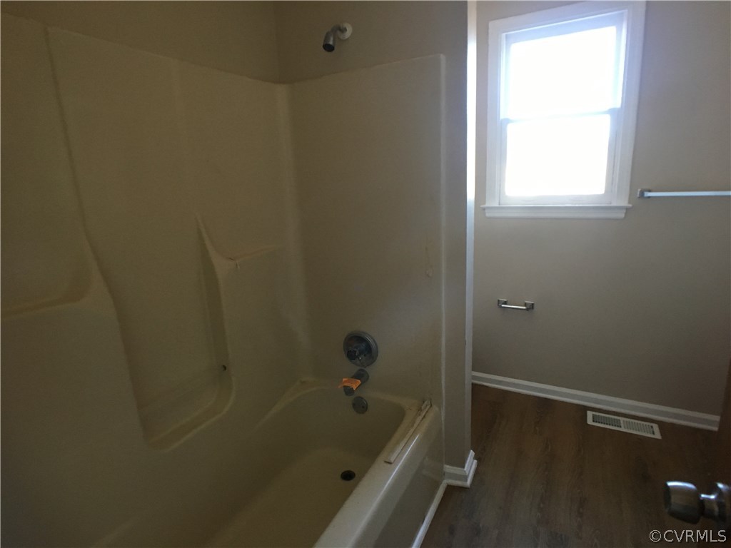 913 Perrymont Road Hopewell, VA 23860 - Photo 11 of 23 a bathroom with a tub and shower