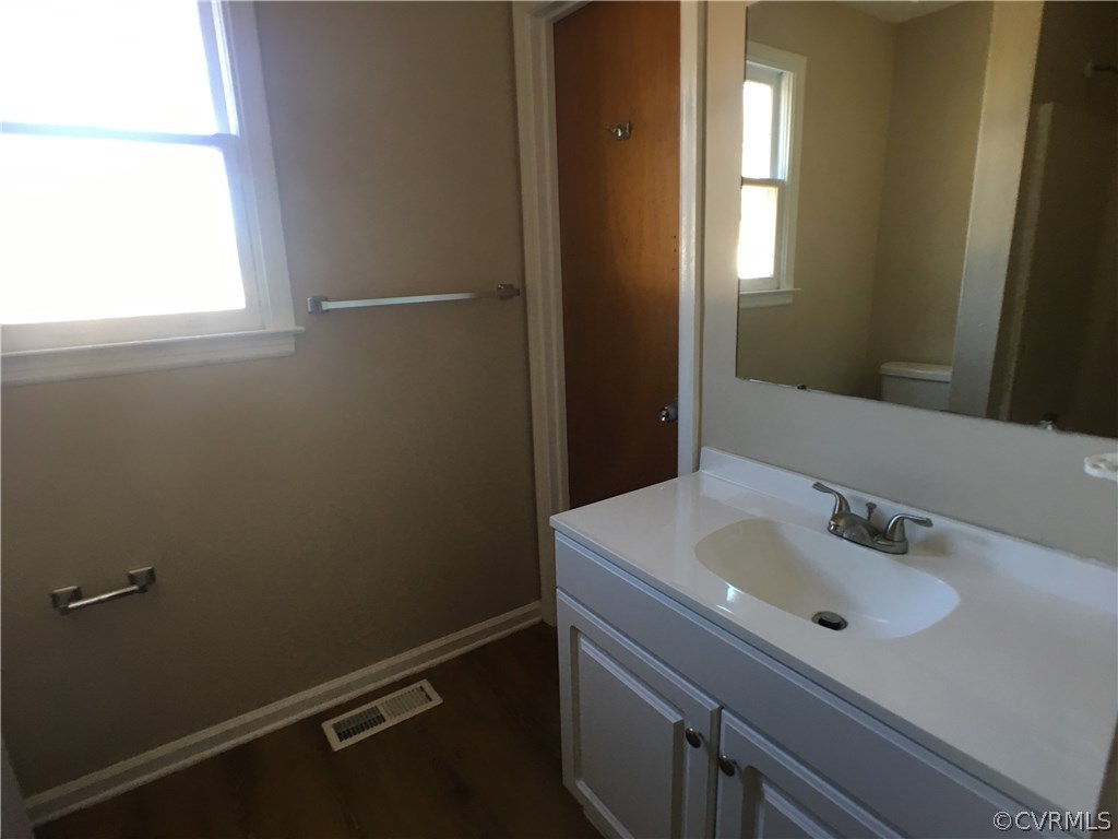 913 Perrymont Road Hopewell, VA 23860 - Photo 12 of 23 a bathroom with a sink and mirror