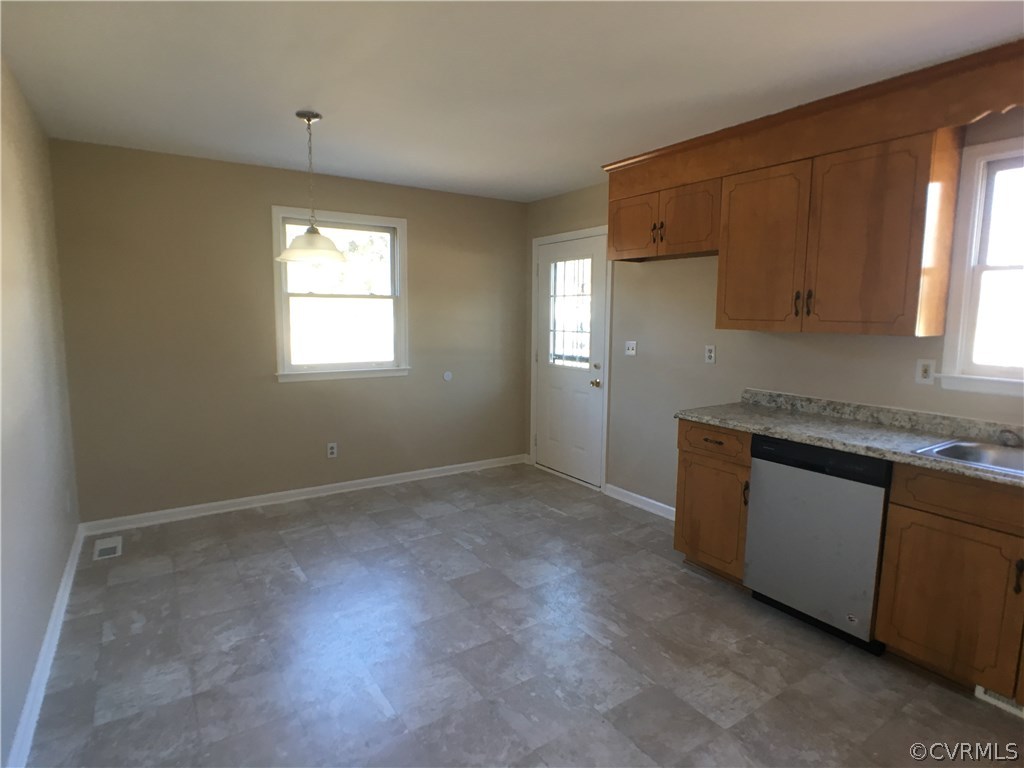 913 Perrymont Road Hopewell, VA 23860 - Photo 13 of 23 a kitchen with granite countertop cabinets stainless steel appliances a sink and a window