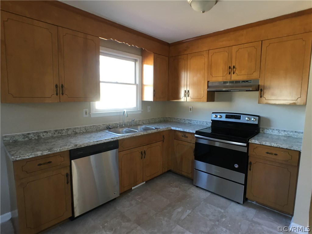 913 Perrymont Road Hopewell, VA 23860 - Photo 15 of 23 a kitchen with granite countertop a sink stove and cabinets
