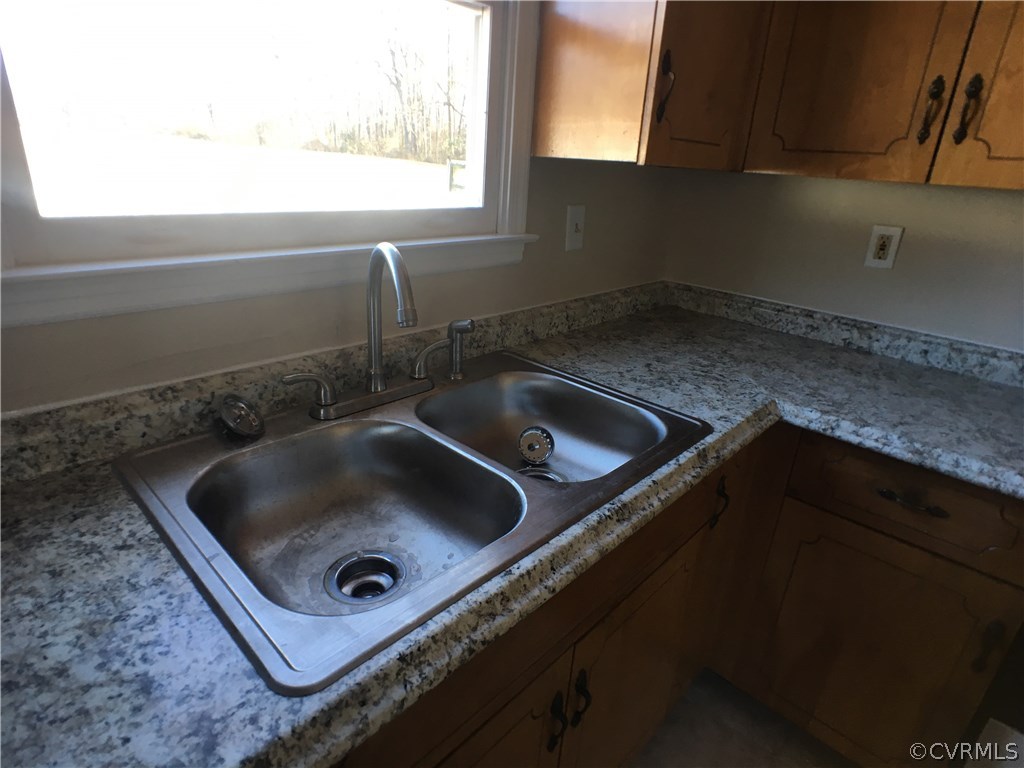 913 Perrymont Road Hopewell, VA 23860 - Photo 16 of 23 a close view of a sink and a window in a kitchen