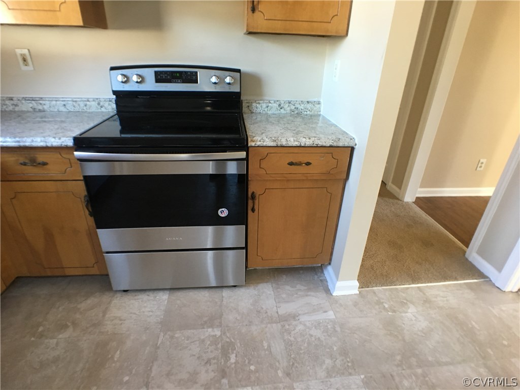 913 Perrymont Road Hopewell, VA 23860 - Photo 17 of 23 a stove top oven sitting inside of a kitchen