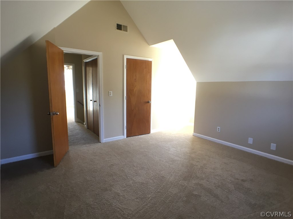 913 Perrymont Road Hopewell, VA 23860 - Photo 23 of 23 a view of an empty room with closet and wooden floor