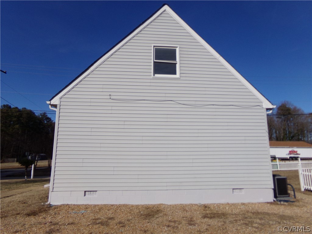 913 Perrymont Road Hopewell, VA 23860 - Photo 6 of 23 a view of a white house with many windows