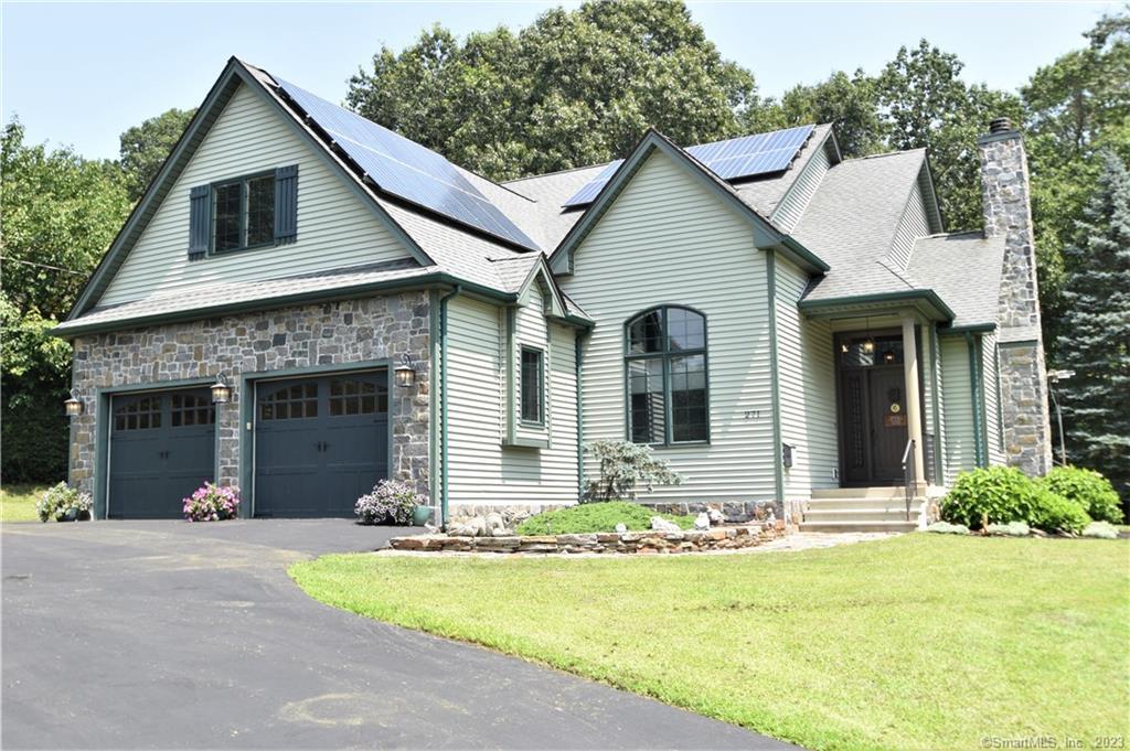 a front view of a house with yard