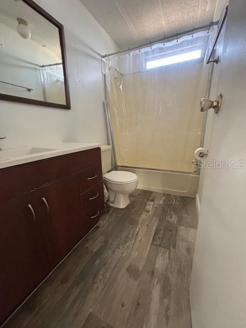 6624 Durian Trail New Port Richey, FL 34653 - Photo 7 of 9 a bathroom with a granite countertop sink toilet and shower