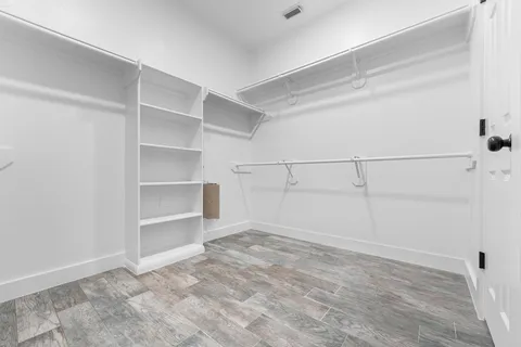 a view of an empty walk in closet