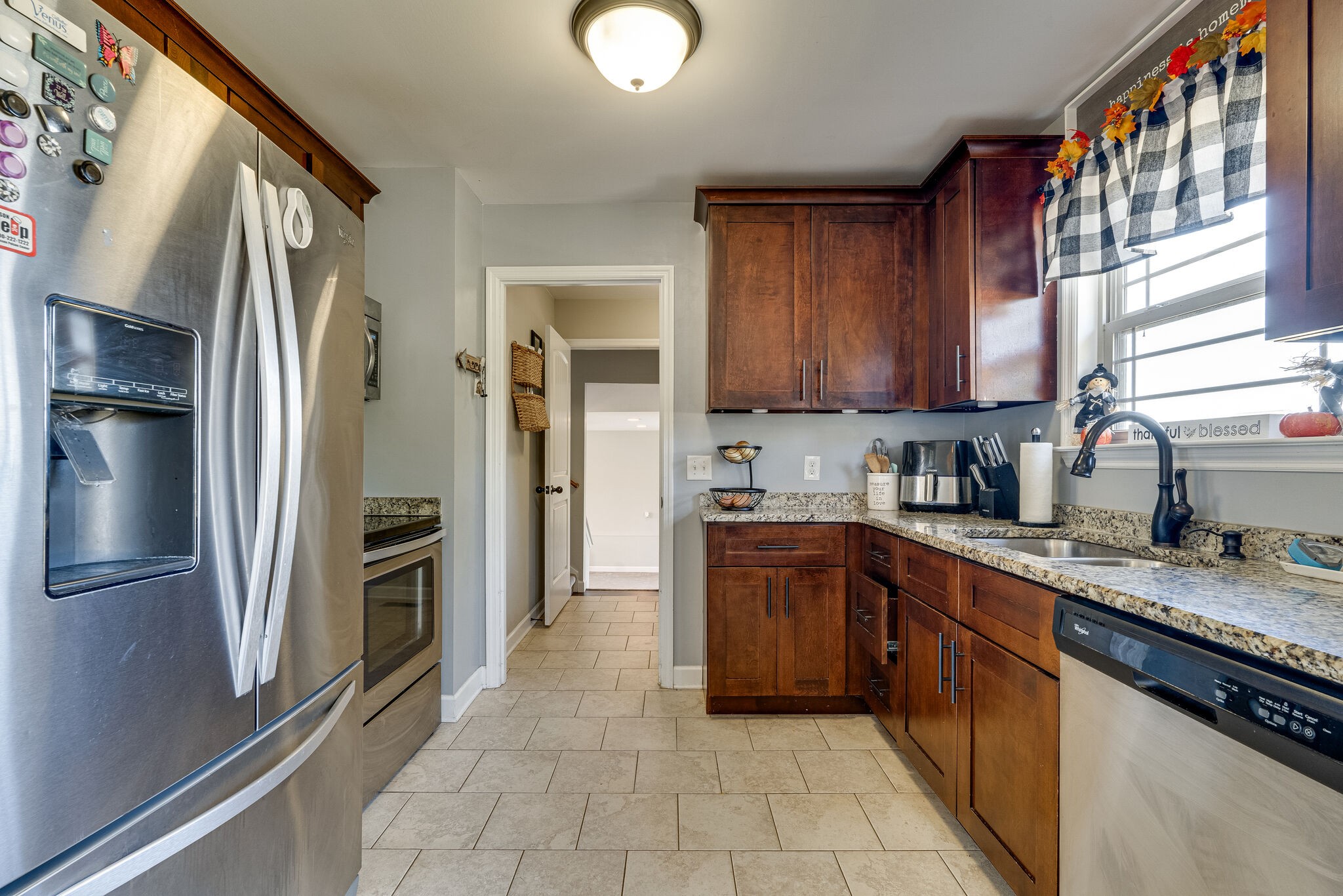 515 Neal Road Watertown, TN 37184 - Photo 11 of 30 a kitchen with stainless steel appliances granite countertop a refrigerator and a sink