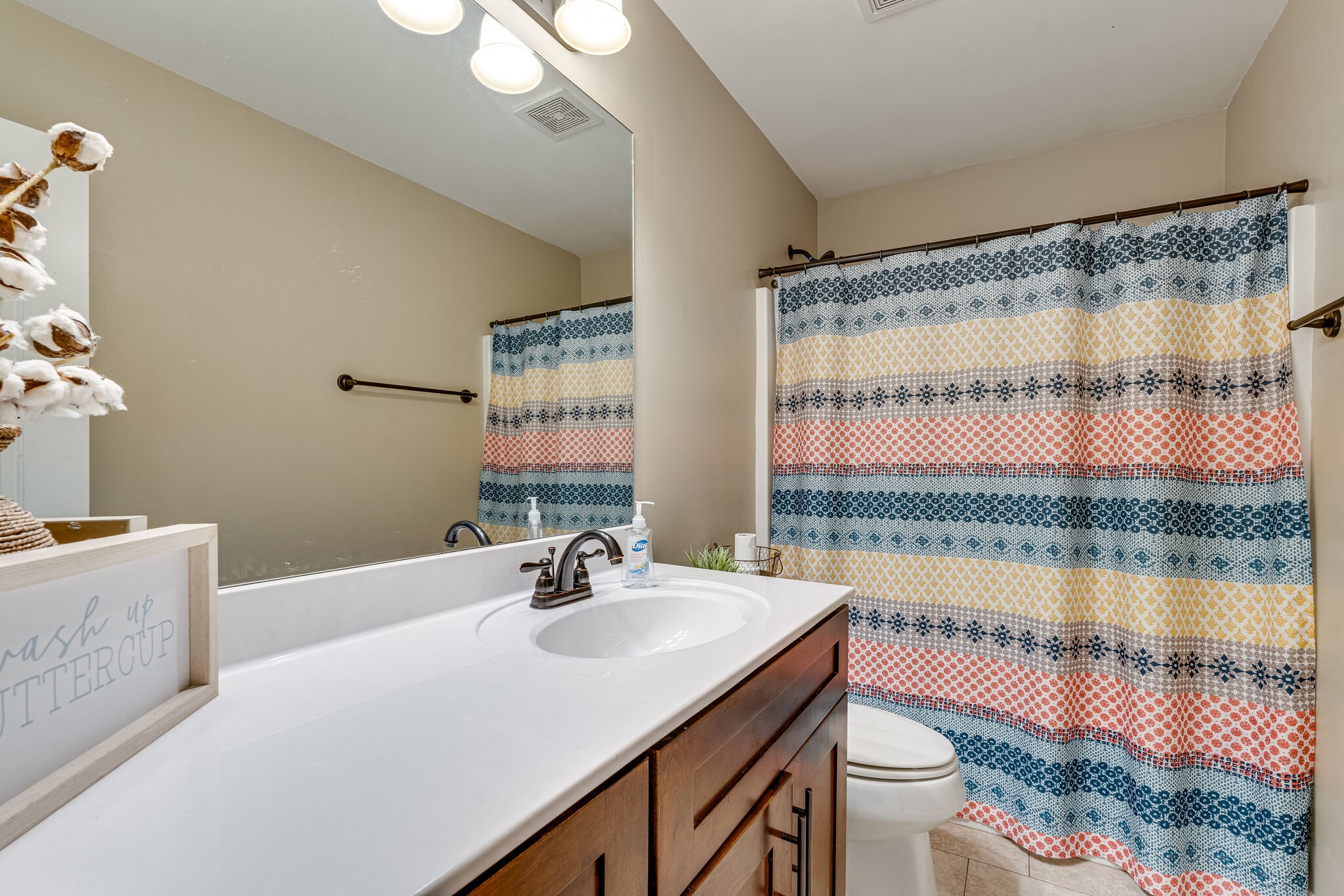515 Neal Road Watertown, TN 37184 - Photo 19 of 30 a bathroom with a sink mirror toilet and window