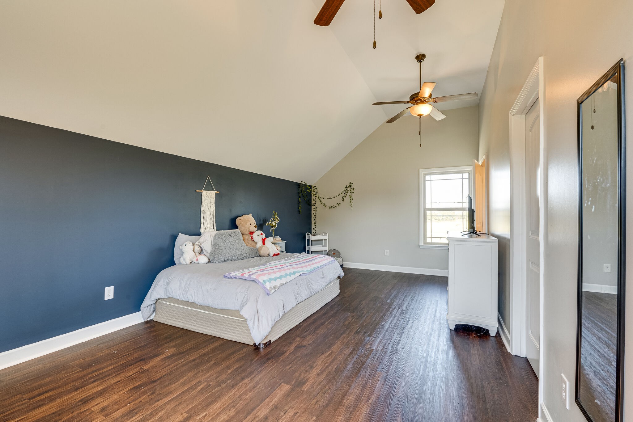 515 Neal Road Watertown, TN 37184 - Photo 24 of 30 a bedroom with a bed and a chandelier