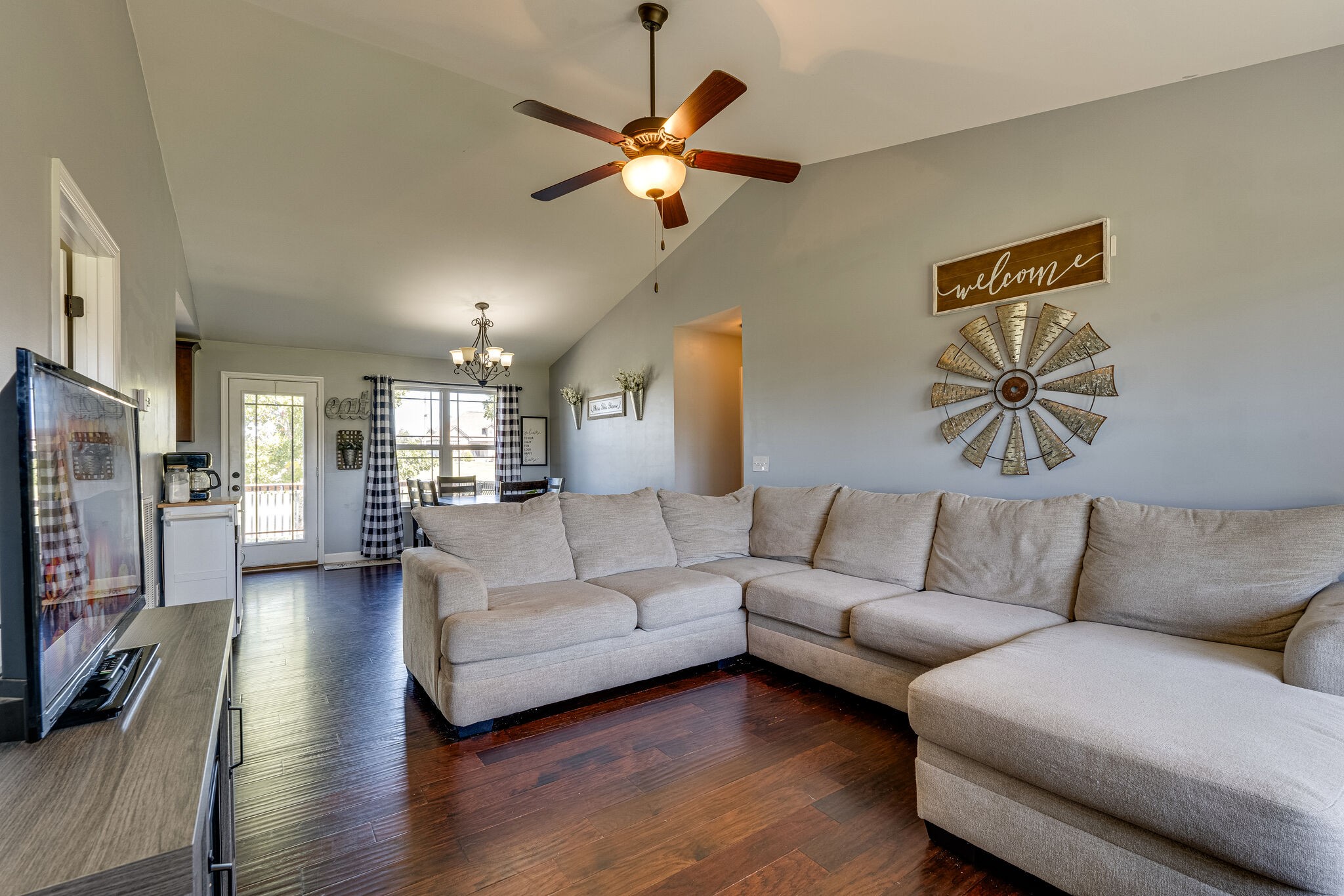 515 Neal Road Watertown, TN 37184 - Photo 7 of 30 a living room with furniture and a large mirror with wooden floor