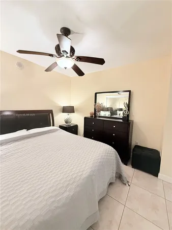 a bathroom with a double vanity sink toilet and shower