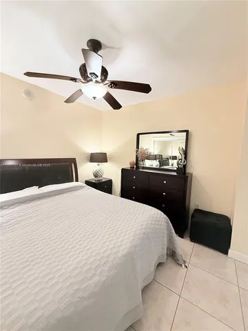 a bathroom with a double vanity sink toilet and shower