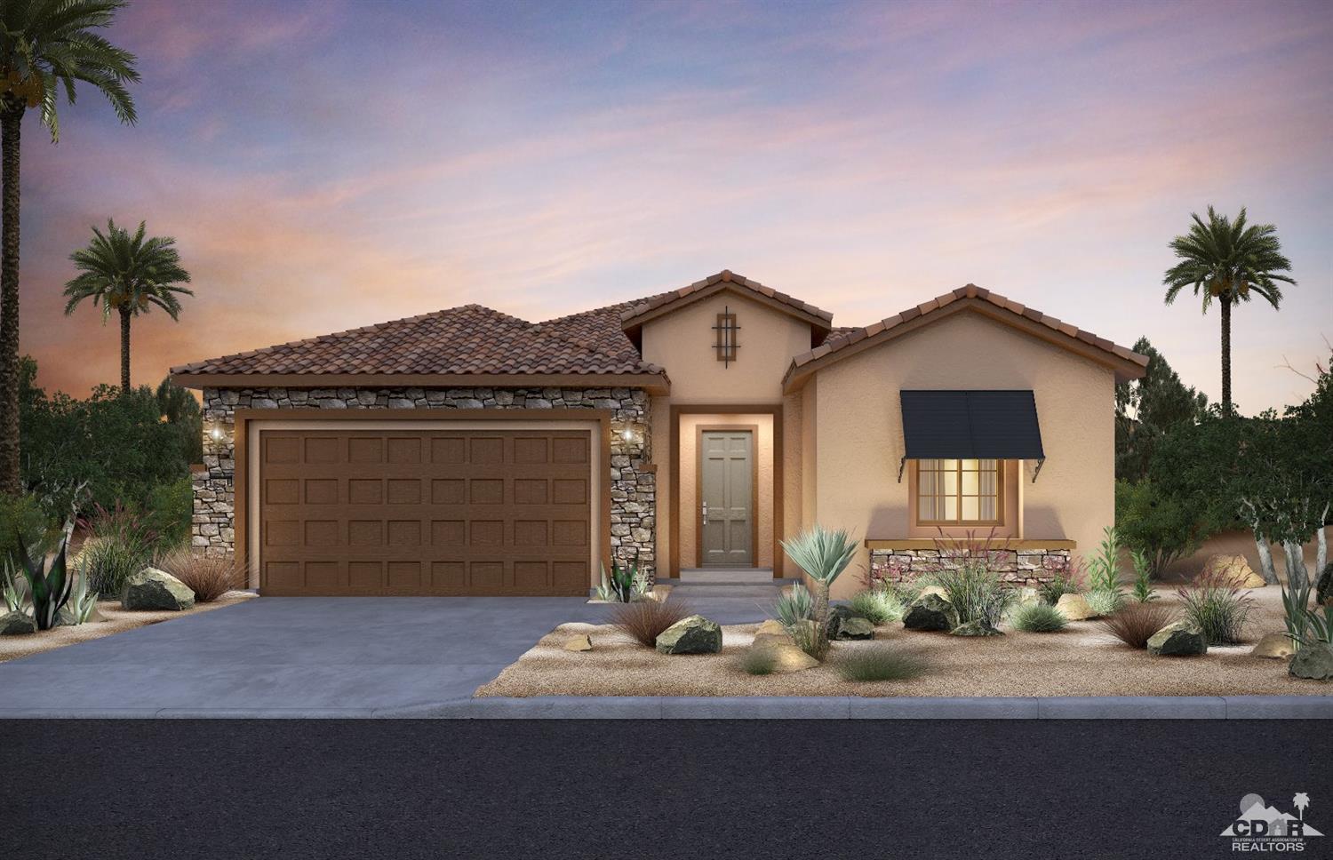 79 Bordeaux Rancho Mirage, CA 92270 - Photo 1 of 2 a front view of a house with a yard and garage