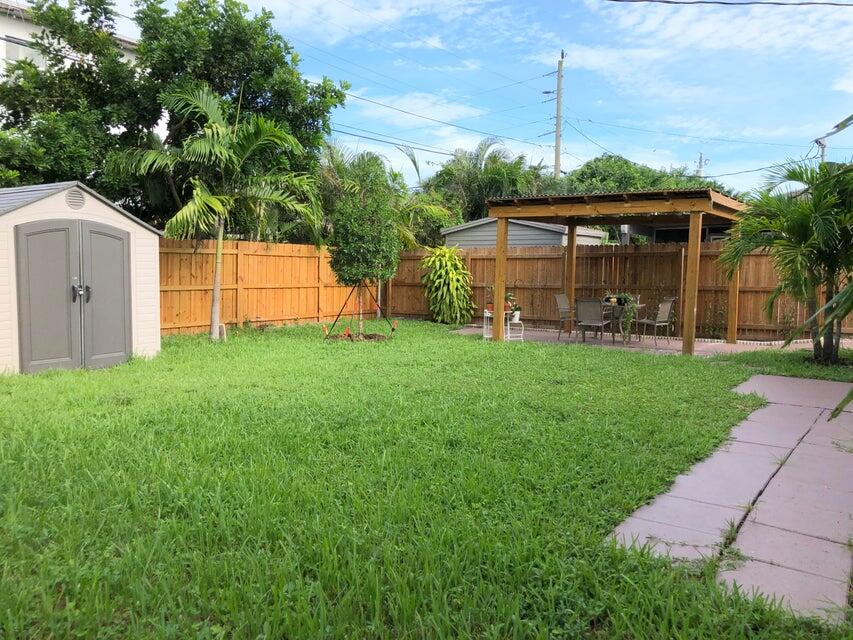 118 Northeast 4th Avenue Deerfield Beach, FL 33441 - Photo 11 of 11 a view of a house with a yard and sitting area