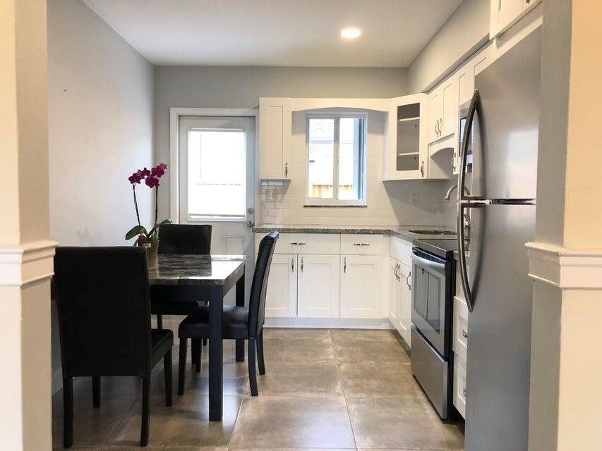 118 Northeast 4th Avenue Deerfield Beach, FL 33441 - Photo 3 of 11 a view of a dining room with furniture and a window