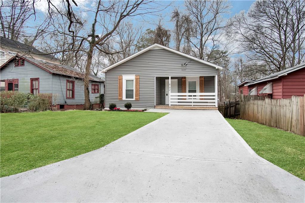 862 Ridge Avenue Northwest Atlanta, GA 30318 - Photo 1 of 1 a front view of house with yard and green space