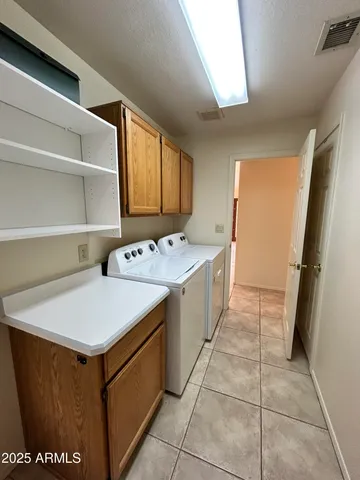 a utility room with washer and dryer