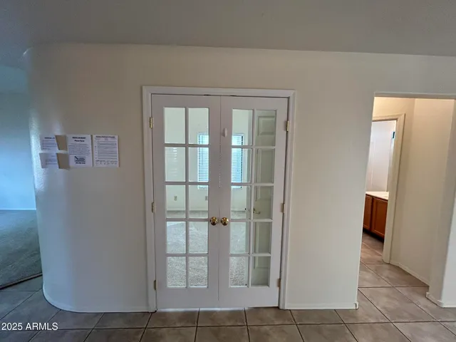 a bathroom with a glass door shower